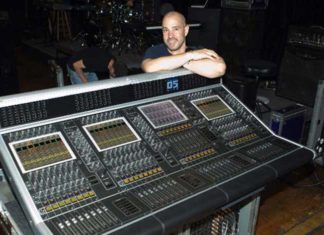 Clay Hutson next to production equipment